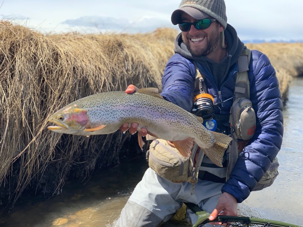 Danny Frank with a trophy lake run rainbow trout from a small stream in Colorado