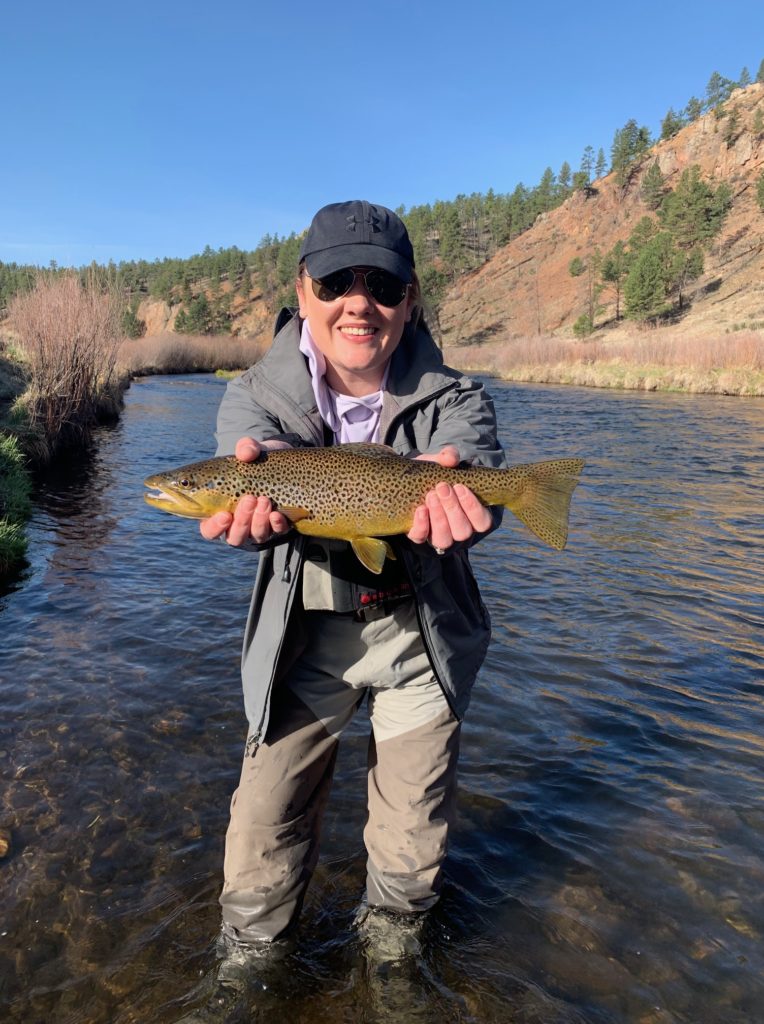 First day fly fishing and she lands this trophy brown from the South Platte near Deckers.