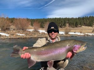 Ty Blount with a 10lbs class Rainbow Trout for a private water lease.