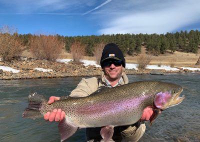 Ty Blount with a 10lbs class Rainbow Trout for a private water lease.