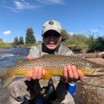 A mouse eating brown trout from a very small creek in South Park Colorado.