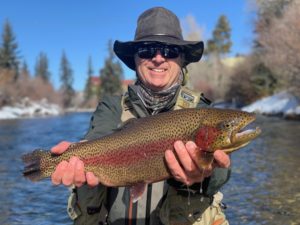 A large rainbow from the Blue River in Silverthorne that ate a small midge.