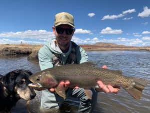 Chris Pandolfi of the Infamous String Dusters with a trophy Dream Stream resident.