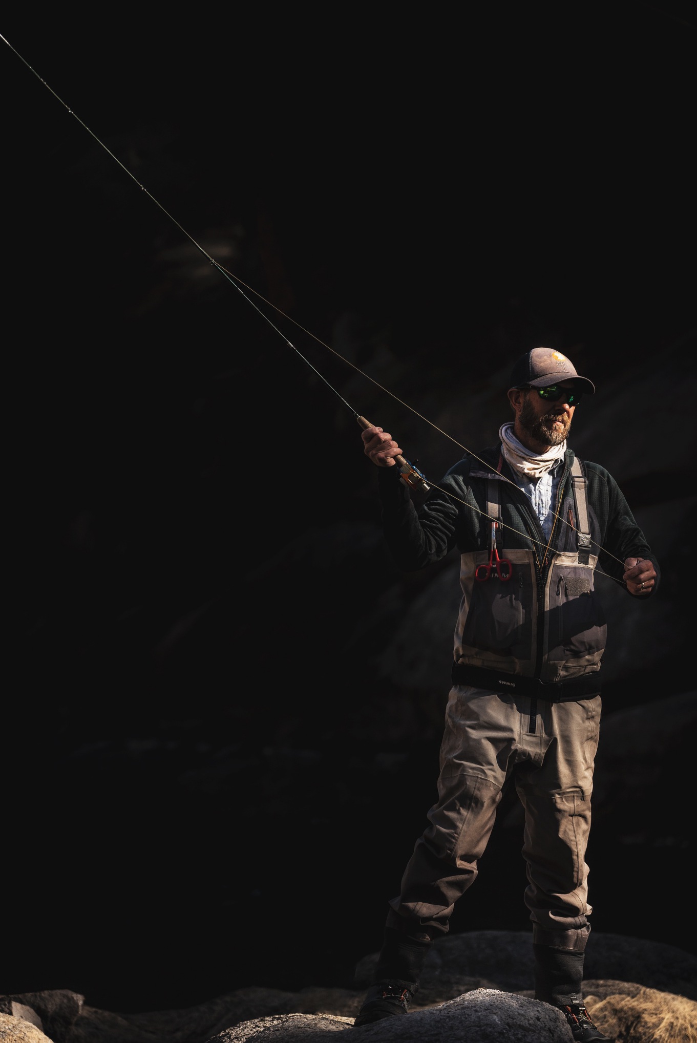 Trout Hunters guide Scott Dickson casting a fly rod.