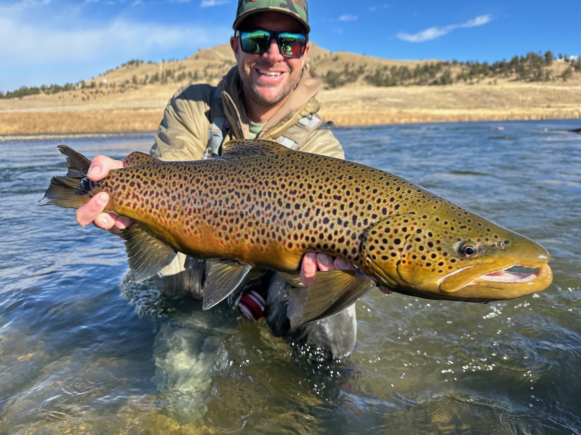 Colorado Trout Hunters guide Matt Sandersen with a giant Dream Stream Brown Trout